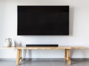 Soundbar below a TV in a living room