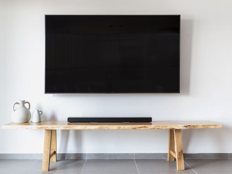 Sonos Arc vs Beam Gen 2: Which Soundbar Should You Actually Buy in 2026? Soundbar below a TV in a living room